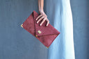 Symmetria soft clutch in rosewood: Gold / Large